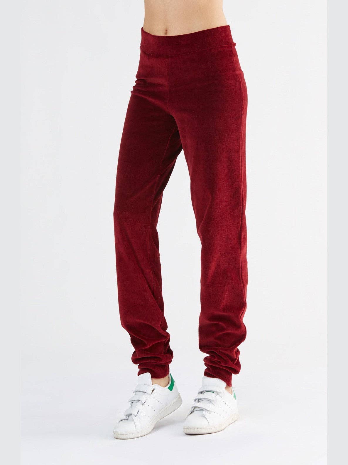 Luxury women's organic cotton soft fleece sweatpants featuring a tapered leg, elegantly cuffed ankles, and a discreet zippered mini pocket.