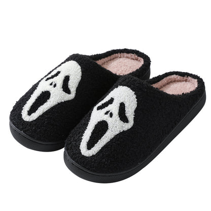 Elegant Halloween Skull Cartoon Print Slippers, showcasing plush black fabric and a striking skull design, ideal for couples seeking warmth and style during chilly evenings at home.