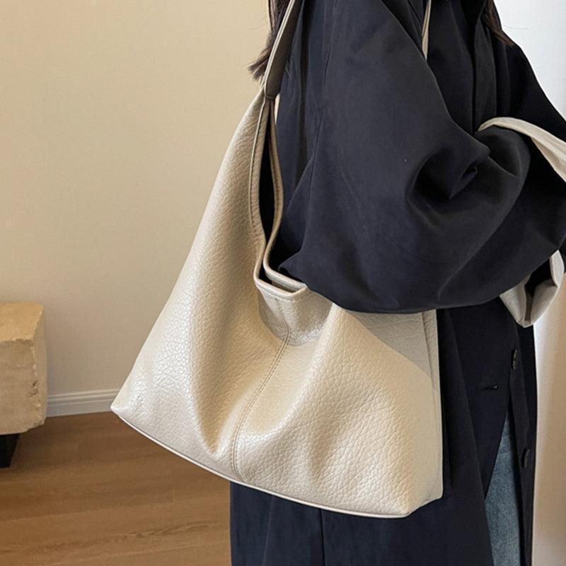 Stylish faux leather shoulder bag set with wallet, capturing the luxury essence and sophistication of Glooosy Store's fashion collection for women.