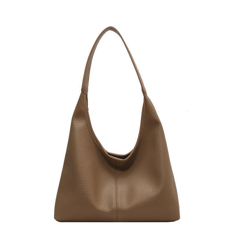 Elegant women's shoulder bag in faux leather with stylish detailing, a perfect accessory for both casual and formal occasions.