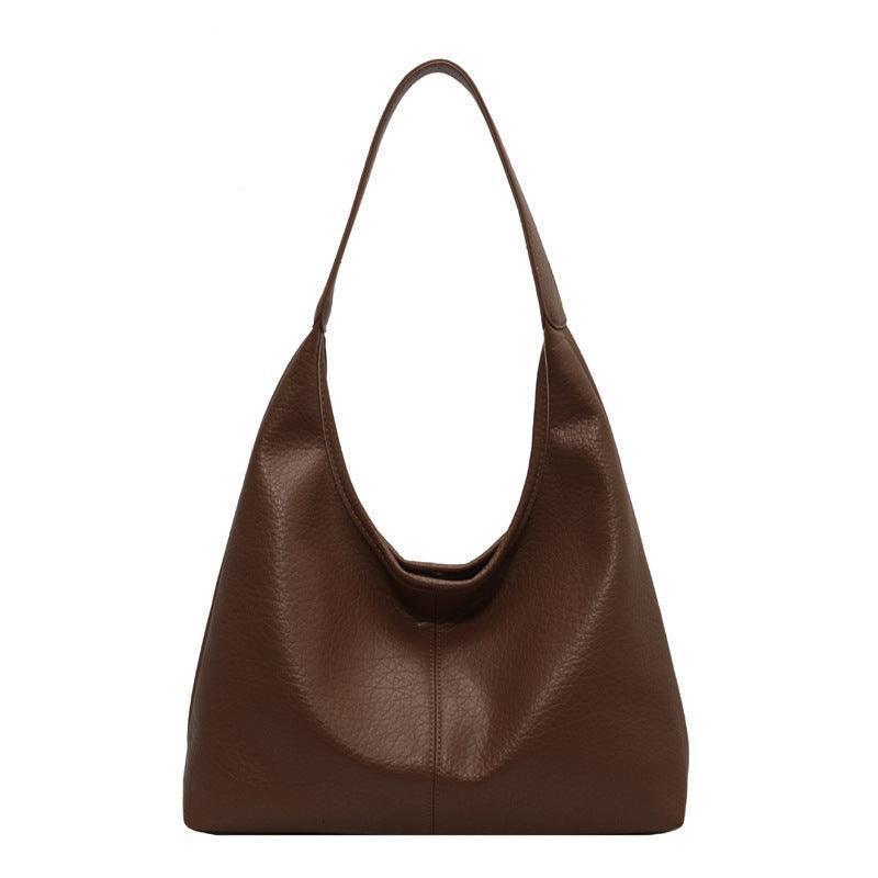 Chic and elegant faux leather wallet matching the luxury shoulder bag, designed for the modern woman who appreciates style and functionality.