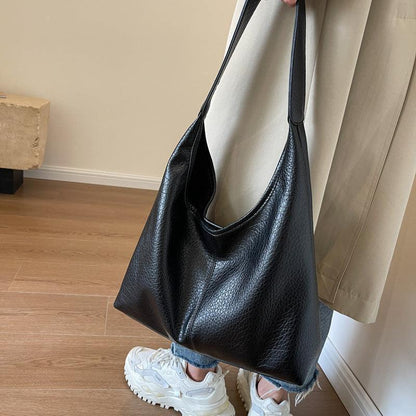 Stylish faux leather wallet included in the luxury handbag set, combining functionality with a sophisticated aesthetic.