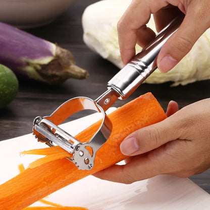 Close-up of hands using the Precision Julienne Stainless Steel Peeler on a vibrant carrot, showcasing its sharp stainless steel blade and ergonomic handle for easy slicing.