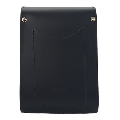 Versatile Handmade Leather Festival Phone Bag shown with adjustable and detachable strap options, styled for a chic cross-body look at an outdoor event.