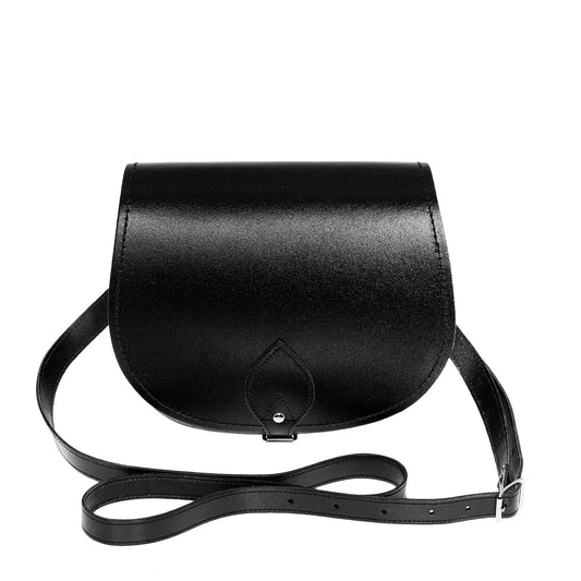 Elegant handcrafted black leather saddle bag showcasing classic design, adjustable strap, and premium craftsmanship.