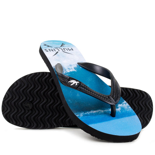 Close-up of textured grip sole of Mullins Bay black flip flops, designed for comfort and safety during sunny days.