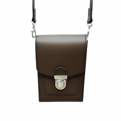 Handmade dark brown leather crossbody phone case with push lock feature, elegant design, and detachable strap, displayed on a luxurious surface.