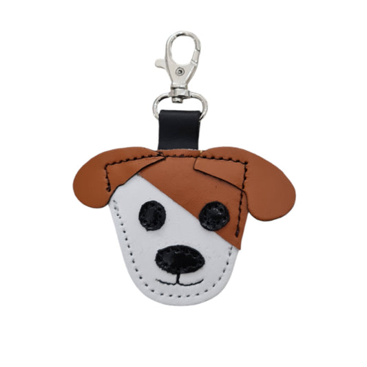 Handcrafted burnt orange dog bag charm by Zatchels, showcasing unique leather craftsmanship and a luxurious finish, ideal for enhancing handbags and luggage.