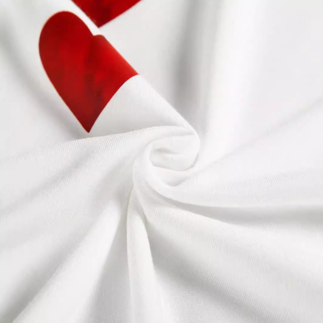 Close-up of the high-quality fabric of the Heart Print Plus Size T-Shirt, showcasing the soft texture and vibrant red heart print on a pristine white background.