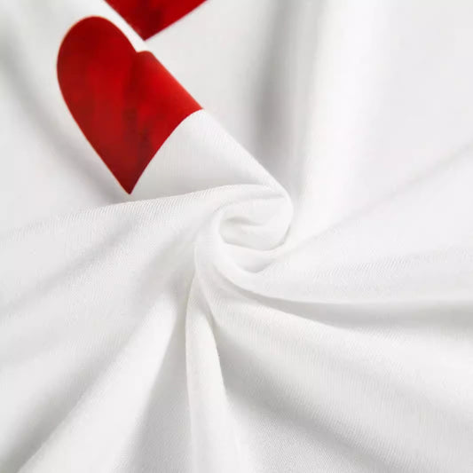 Close-up of the high-quality fabric of the Heart Print Plus Size T-Shirt, showcasing the soft texture and vibrant red heart print on a pristine white background.
