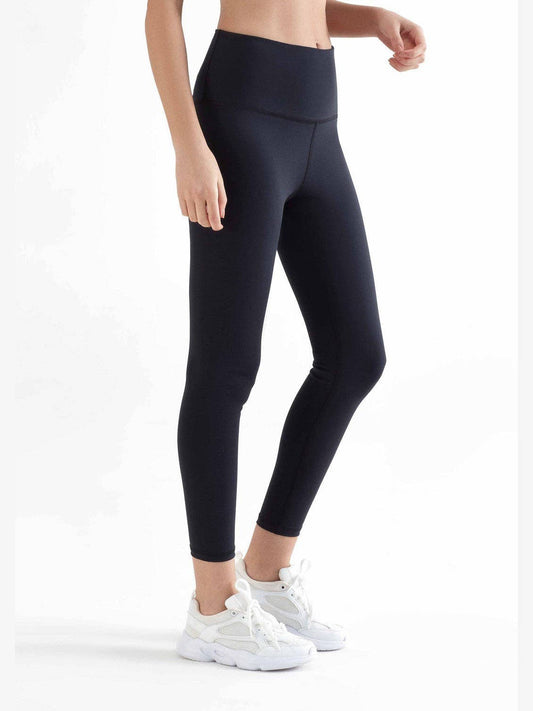 Elegant luxury organic 7/8 stretch leggings for women featuring a high-rise waistband and soft yet firm fabric for a comfortable fit.