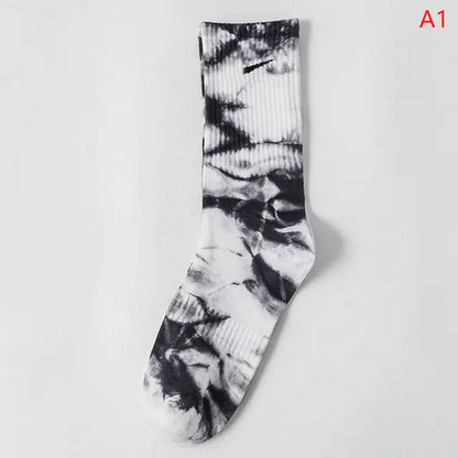 Elegant black and white tie-dye middle tube socks showcasing a trendy pattern for all-day style and comfort.