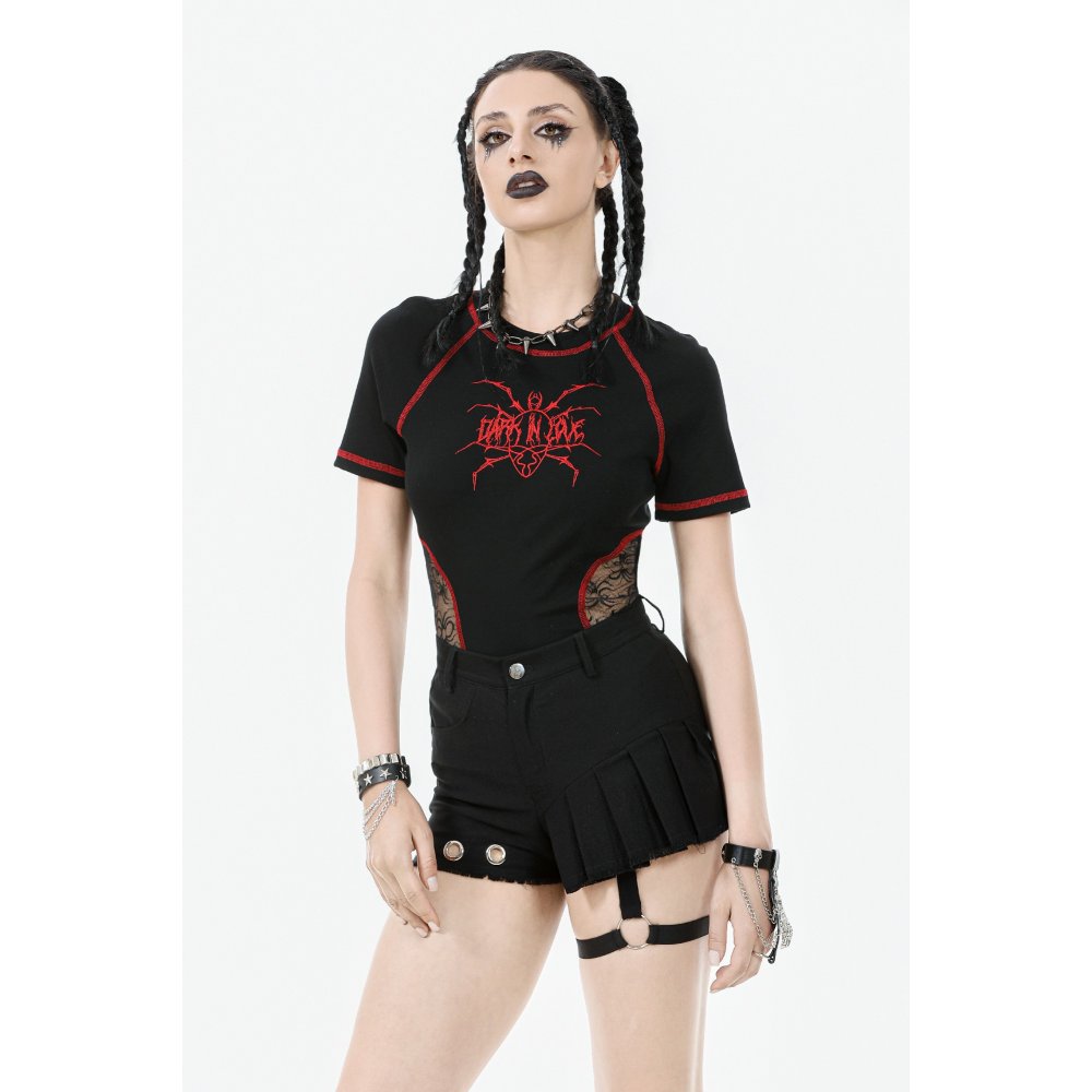 High-waisted black garter shorts with pleated asymmetrical panel and striking silver grommet accents, embodying edgy elegance for gothic fashion enthusiasts.