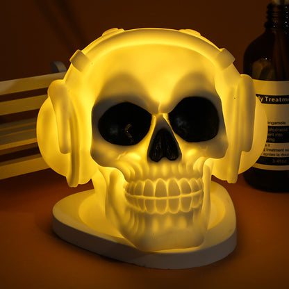 Illuminated skull night light showcasing a striking yellow glow, enhancing the allure of Halloween festivities.