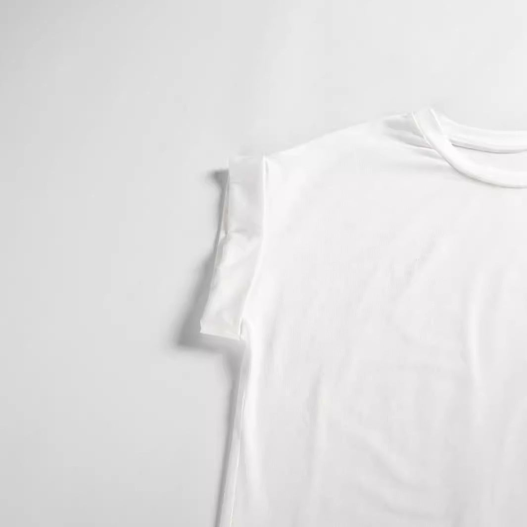 Elegant view of the Heart Print Plus Size T-Shirt laid flat, highlighting its simple yet sophisticated design and classic white tone.