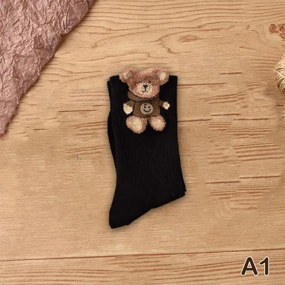 Luxurious bear-themed black socks featuring an adorable teddy bear design, embodying playful luxury and comfort.