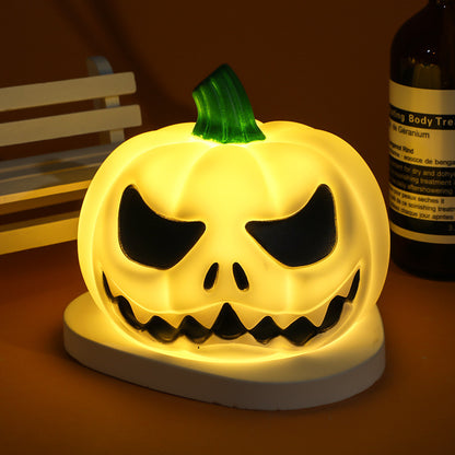 Glowing pumpkin lamp with an intriguing design, bringing warmth and elegance to your Halloween decor.