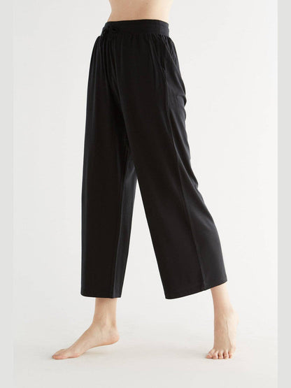 Luxurious women's Tencel wide leg trousers showcasing a soft and flowing design in eco-friendly fabric.