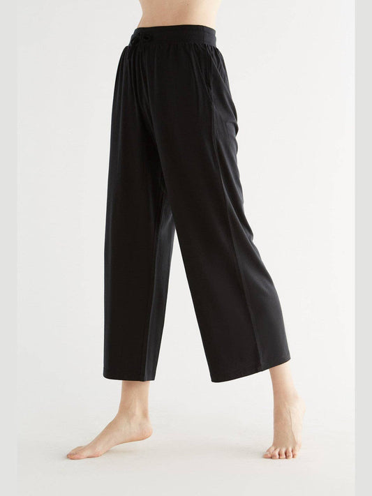Luxurious women's Tencel wide leg trousers showcasing a soft and flowing design in eco-friendly fabric.