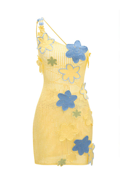 Elegant summer Capri dress adorned with intricate 3-D crocheted flowers and stylish cross back design, perfect for warm days and nights.