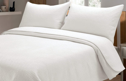 Stylishly arranged Capri Bedspread Set on a bed, blending elegance with functionality, perfect for enhancing modern home interiors.