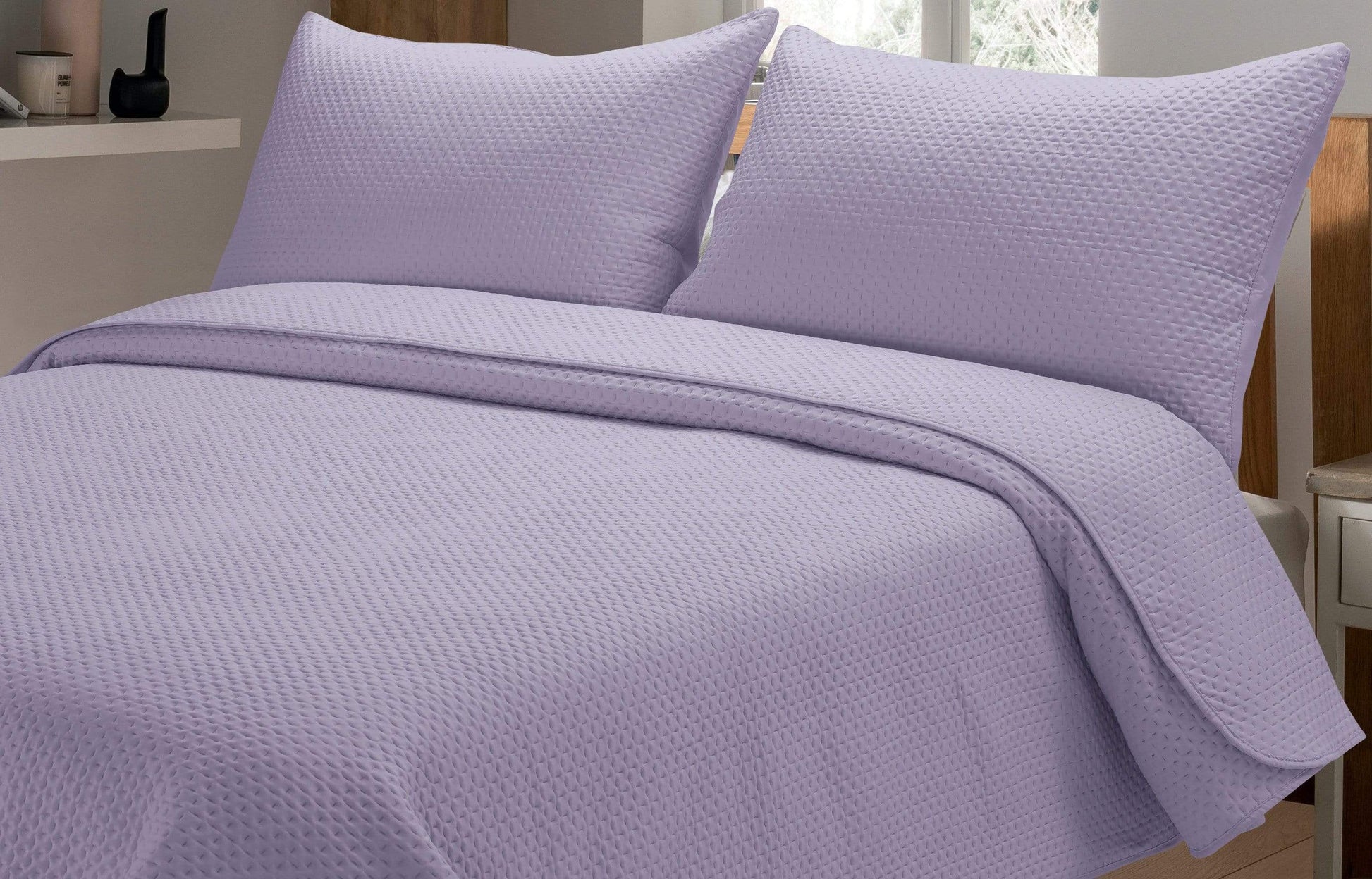 Close-up view of the luxurious embroidered pillow shams from the Capri Bedspread Set, adding a touch of opulence to any sleeping space.