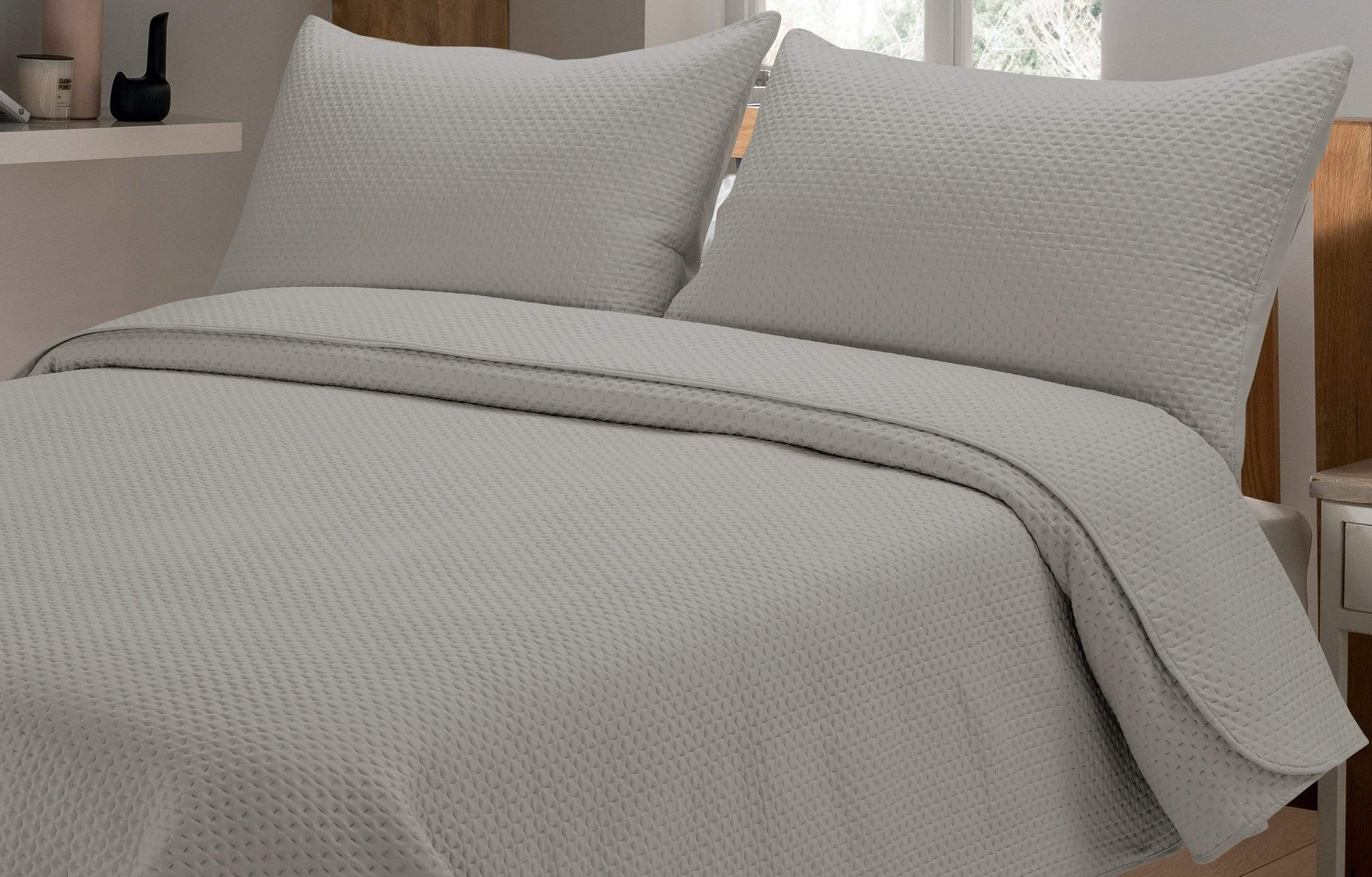 Close-up view of luxurious embossed detail on Capri Bedspread, showcasing intricate texture and craftsmanship.