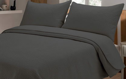 Close-up view of the embossed detailing on the Capri Bedspread, showcasing premium craftsmanship and luxury texture for an upscale bedroom aesthetic.
