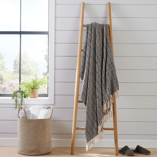 Luxurious Casablanca Super Soft Throw Blanket made from eco-friendly recycled cotton, featuring an elegant check design and charming tassels, perfect for enhancing your home decor.
