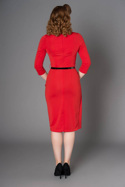 Close-up detail of the stylish V-neckline and quarter sleeves of the Timeless London Katie Red Dress, highlighting the smooth polyester fabric and elegant design.