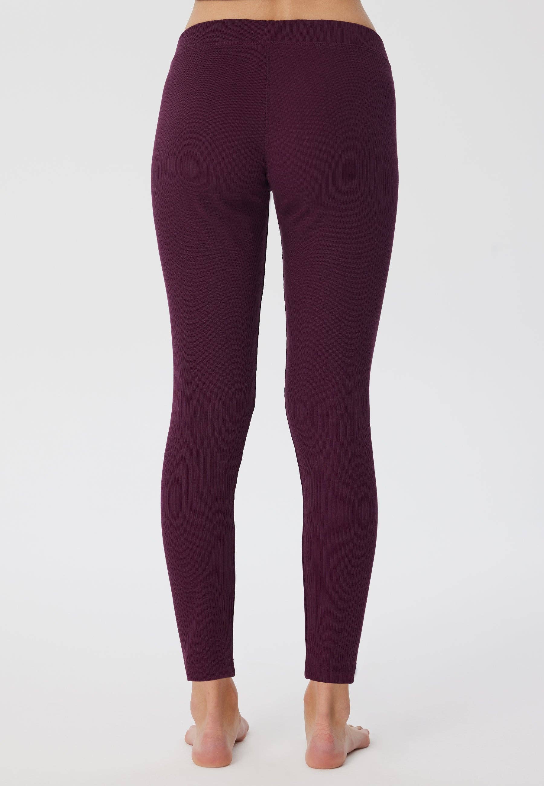 Elegant women's organic cotton ribbed leggings featuring a soft elasticated waist, designed for comfort and style.
