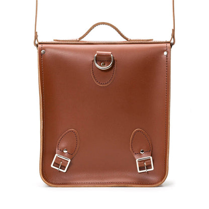Luxurious Handmade Chestnut Leather City Backpack displayed with intricate details, showcasing its soft light brown interior and traditional buckle fastenings.