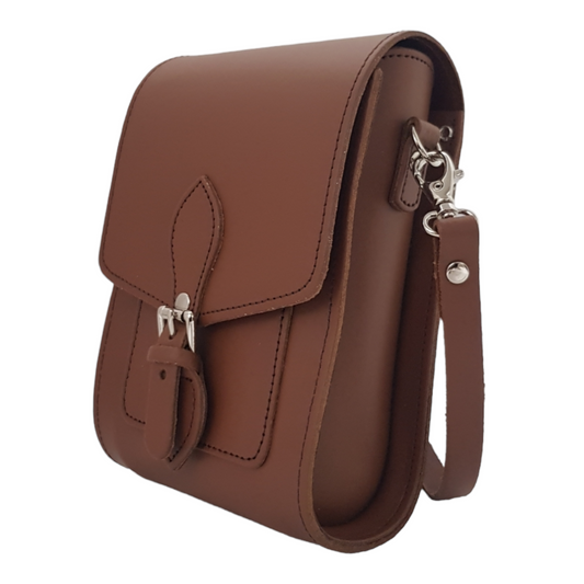 Handcrafted Chestnut Leather Festival Phone Bag showcasing luxurious design with adjustable strap and magnetic closure, perfect for stylish festival attendees.