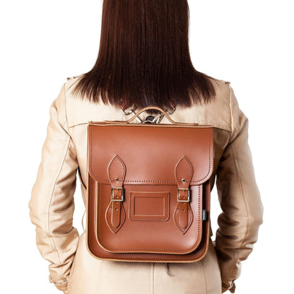 Customizable Handmade Chestnut Leather City Backpack with engravings, emphasizing its elegant craftsmanship and adaptability to different styles and occasions.