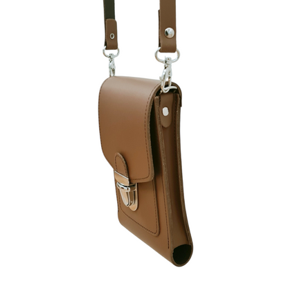 Lifestyle shot of the Luxury Leather Crossbody Phone Case worn crossbody, emphasising versatility and elegance.