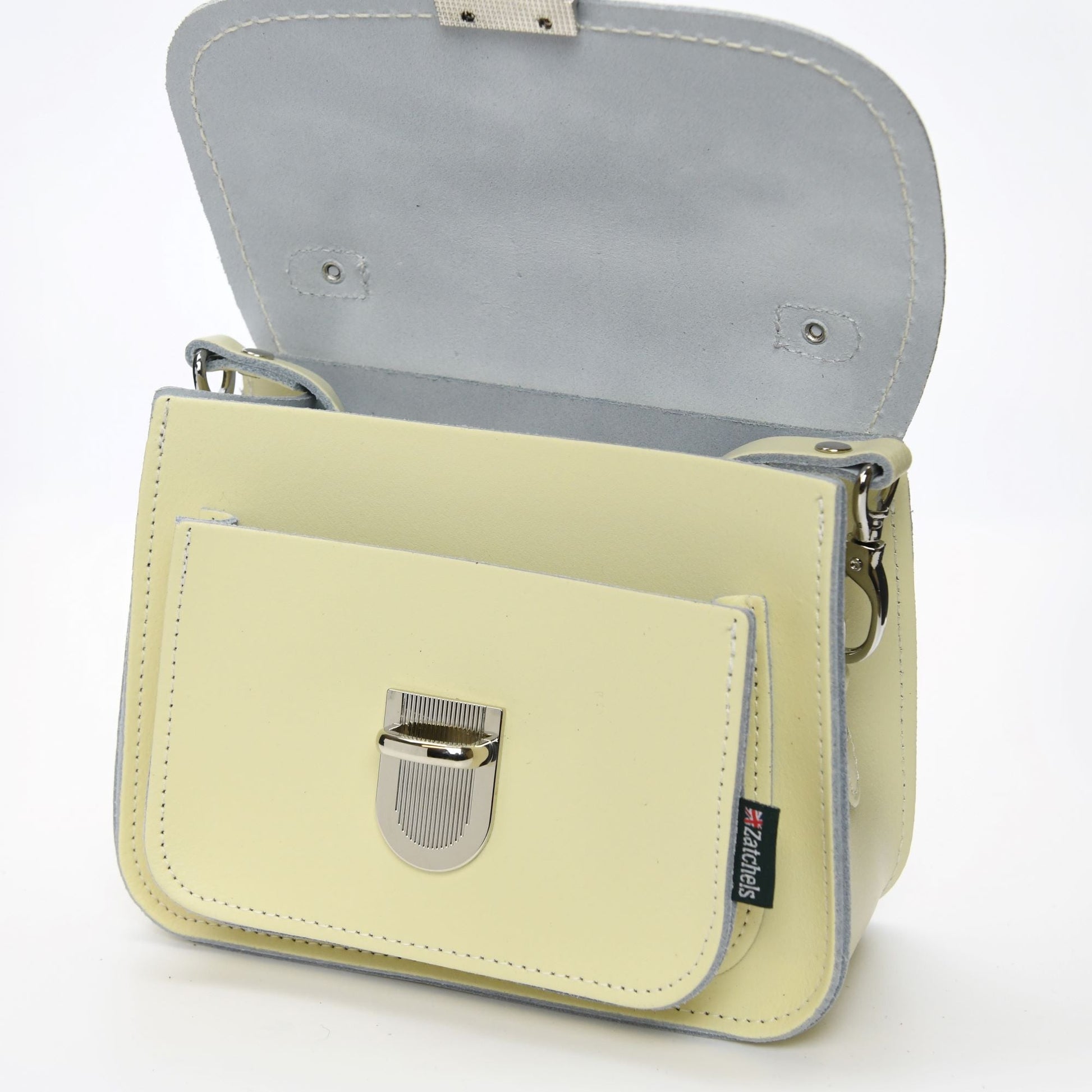 Stylish model carrying the Luna Cream Handmade Leather Bag, embodying sophistication and versatility for day-to-night occasions.