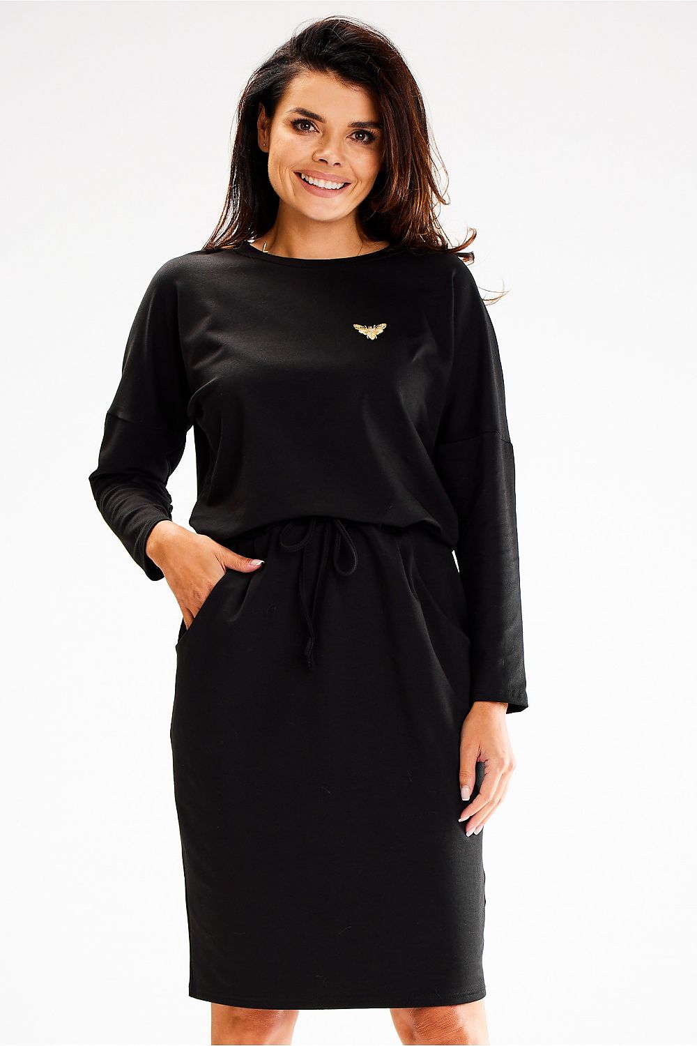 Close-up detail of the waist tie and applique on the Awama loose daydress.