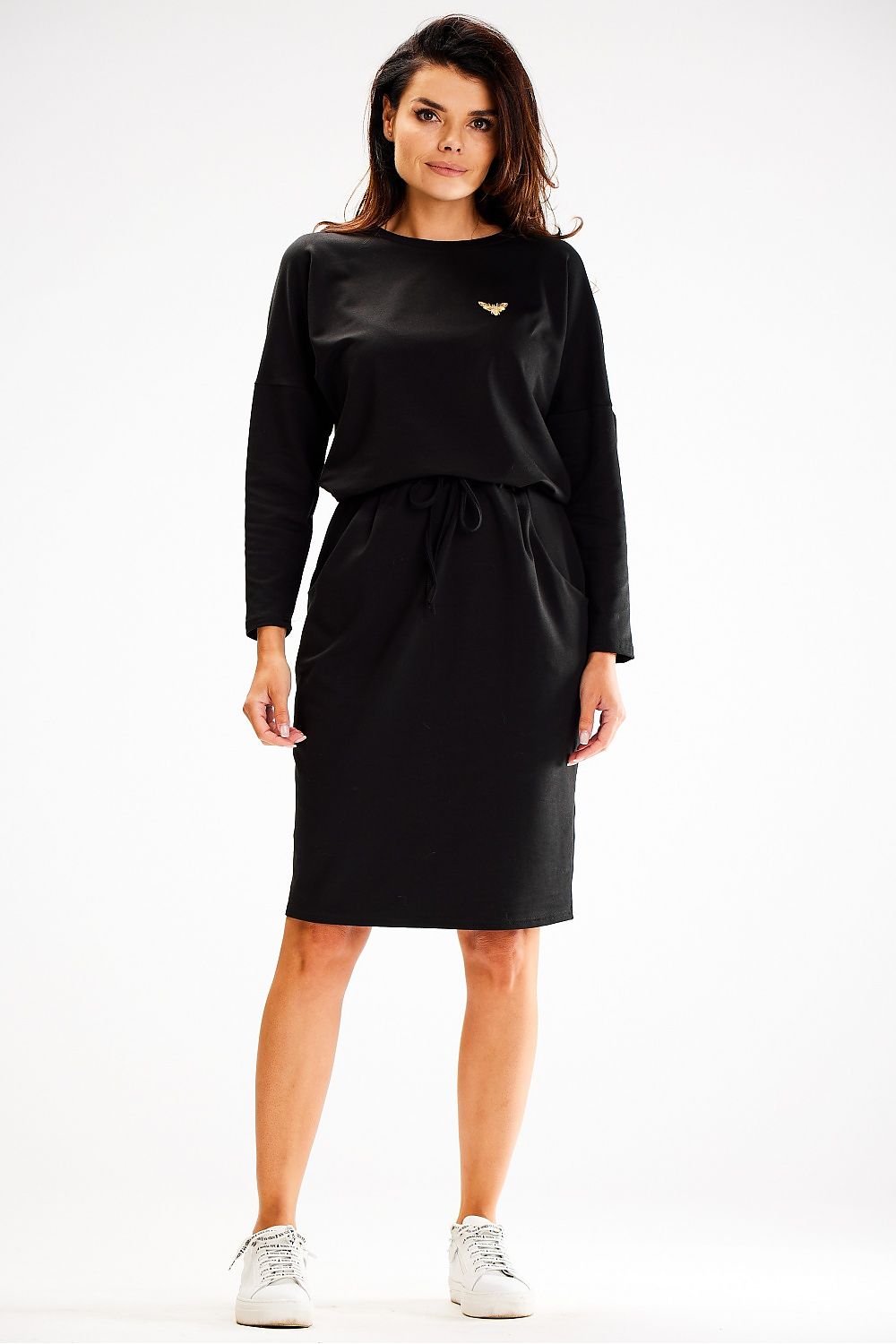 Side view of Awama's stylish loose daydress showcasing its long sleeves and flowing silhouette.