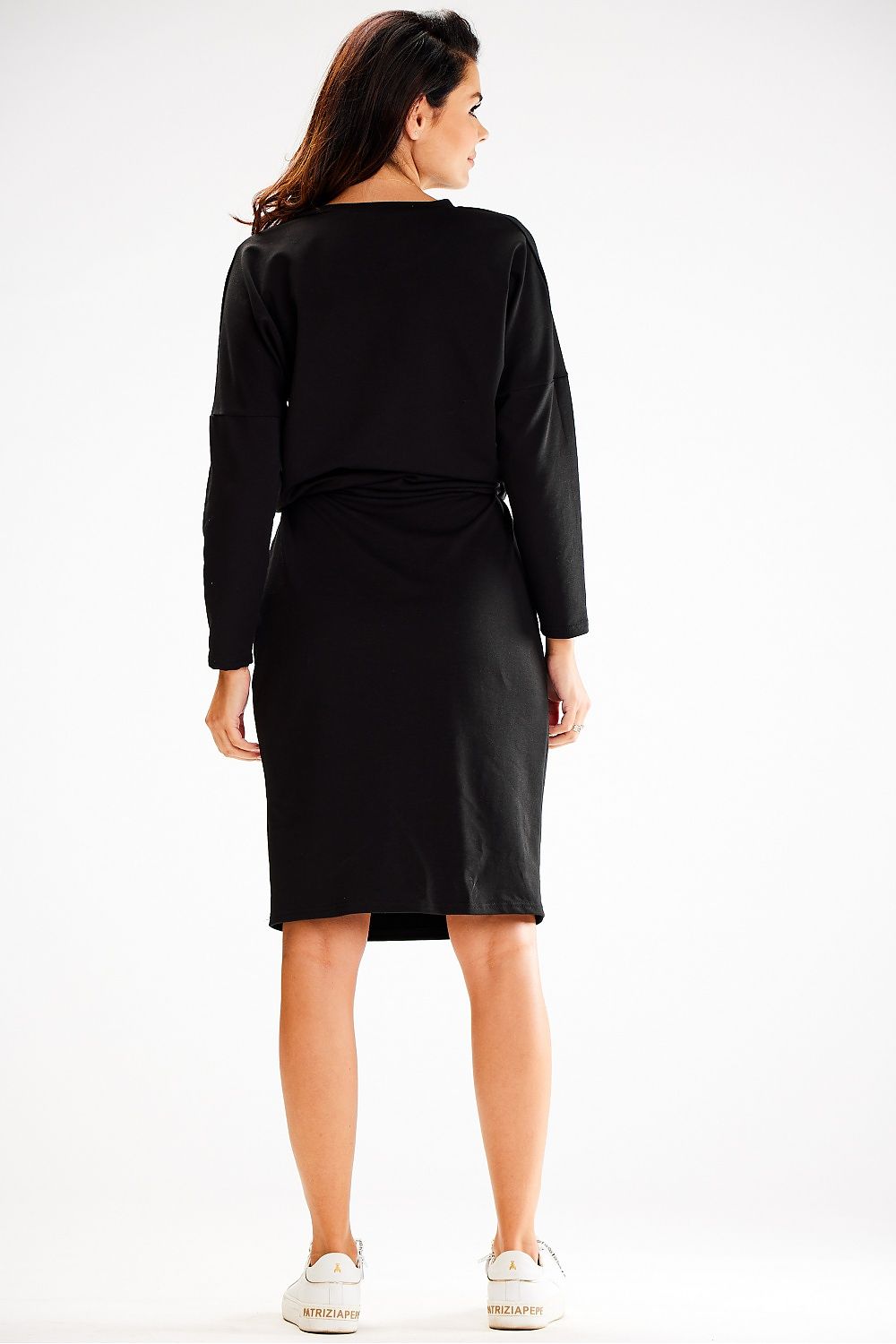 Model wearing Awama elegant loose daydress highlighting its versatility with pockets and a flattering fit.