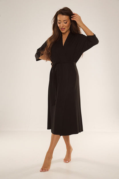De Lafense women's bathrobe in a sophisticated setting, emphasising its 3/4 sleeve design and delicate waist binding for a fashionable look.
