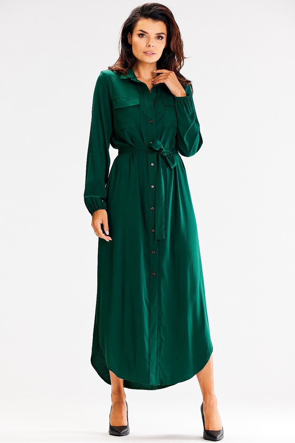 Elegant Awama loose maxi dress with long sleeves and buttoned front, showcasing a chic waist tie and large pockets.