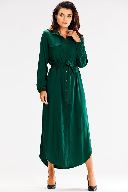 Elegant Awama loose maxi dress with long sleeves and buttoned front, showcasing a chic waist tie and large pockets.