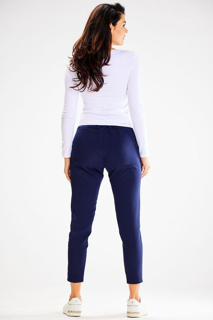 Side view of Awama stylish fitted tracksuit trousers highlighting the sleek lines and practical side pockets.
