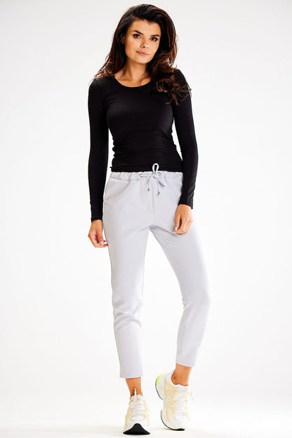 Awama fitted tracksuit trousers displayed on a chic model, emphasizing comfort and elegance in activewear.