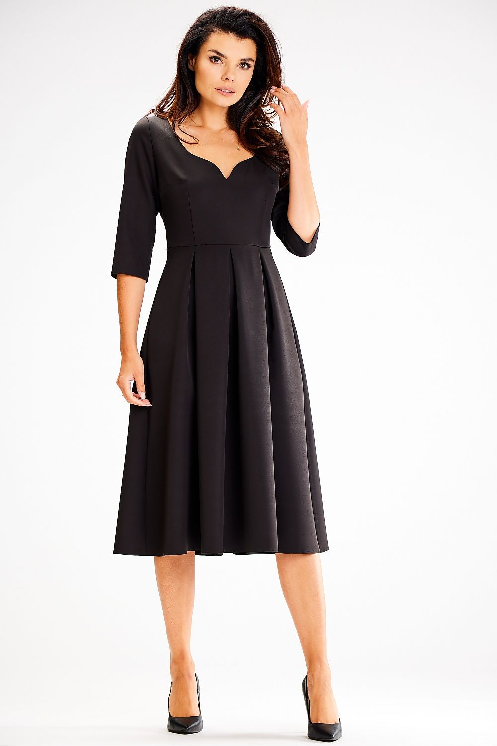 Back view of the Awama Daydress with covered zipper closure, emphasizing the elegant fit and sophisticated style.