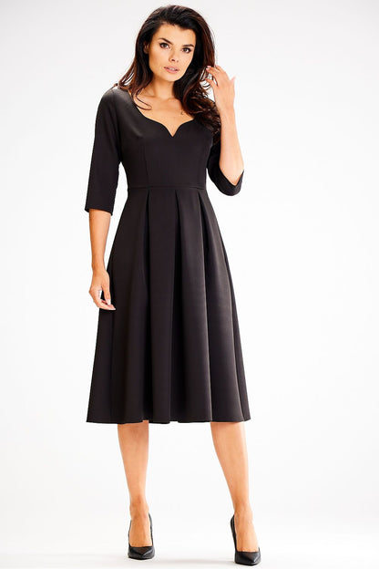 Back view of the Awama Daydress with covered zipper closure, emphasizing the elegant fit and sophisticated style.