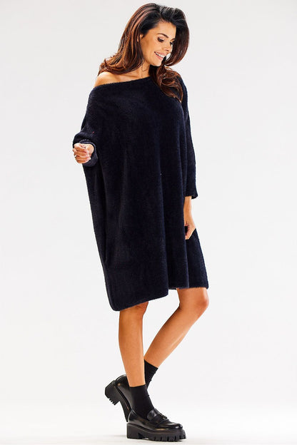 Stylish oversized long sleeve knitted jumper by Awama, perfectly draped on a model, emphasising its luxurious 100% nylon material.