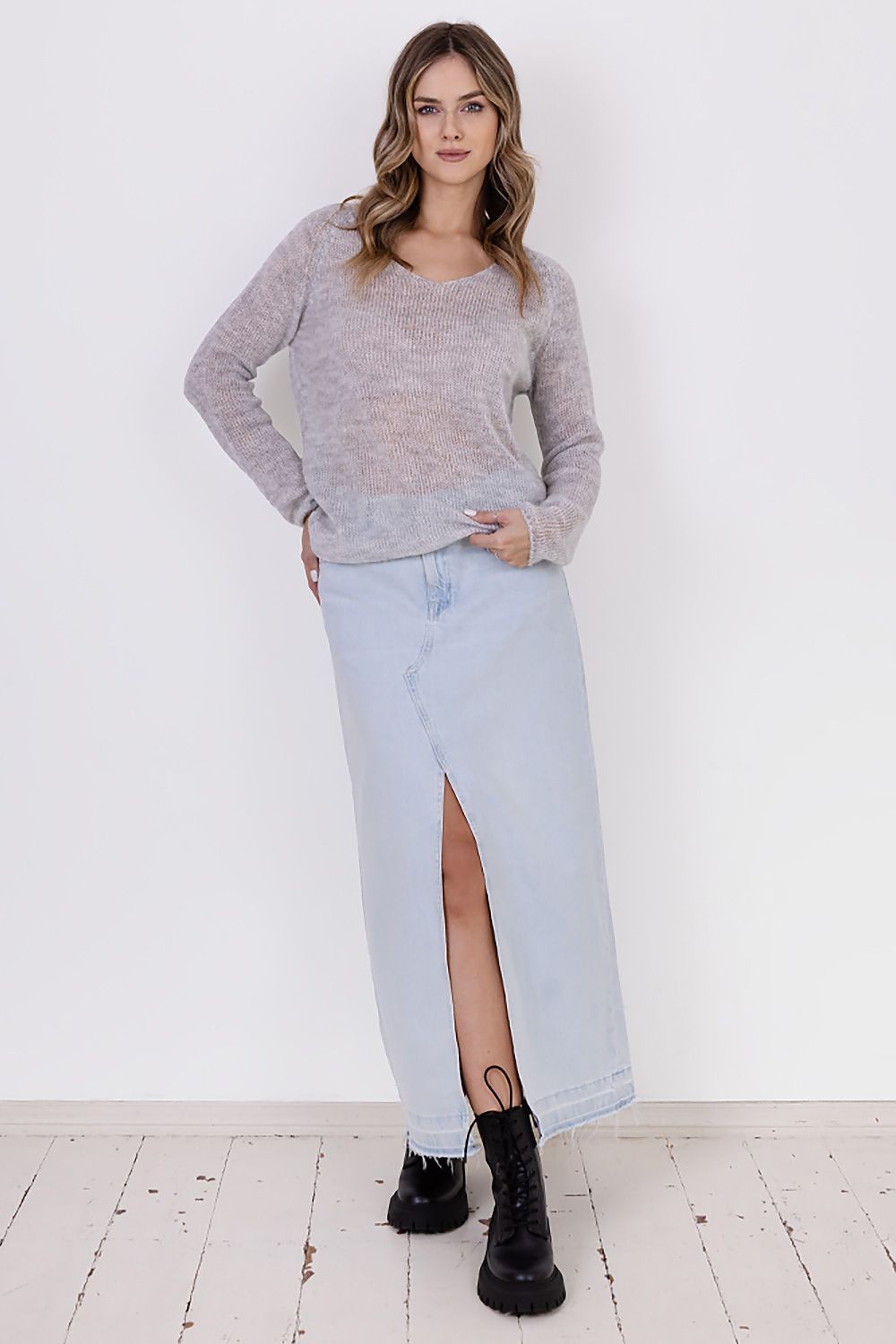 Close-up of MKM's transparent sweater, highlighting its soft fabric and stylish design for effortless elegance.