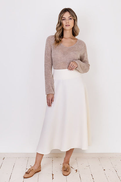 Back view of MKM Transparent Sweater highlighting the loose form and understated elegance, suitable for the colder season.