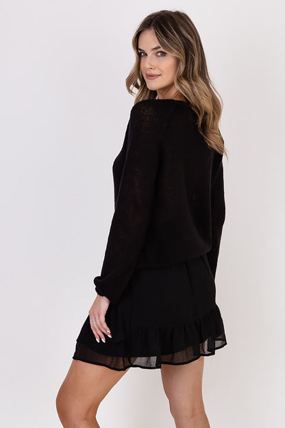 Model wearing MKM Lightweight Transparent Sweater, featuring a relaxed fit and facial neckline, ideal for versatile styling through various occasions.